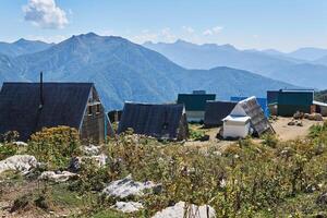 temporary settlement of pastoralists during the grazing season in mountain pastures in the Caucasus, Russia photo