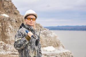 woman geologist at the edge of the quarry photo