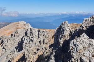 summit ridge with sheer cliffs of Mount Oshten in the western Caucasus photo
