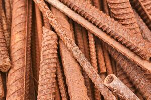 pieces of rusty rebar piled in a heap close-up photo