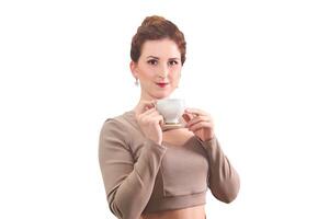 young woman with tea cup on white background photo