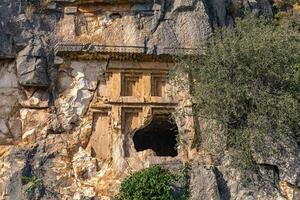 antique tomb carved into the rock near Myra of Lycia photo