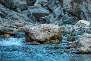 rocks in a mountain stream at the bottom of the canyon close-up photo