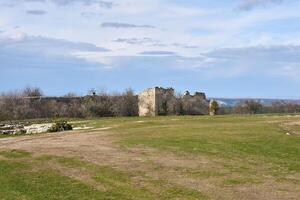 dilapidated walls of the medieval fortress Chufut-Kale, Crimea photo