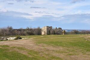 dilapidated walls of the medieval fortress Chufut-Kale, Crimea photo