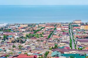 top view from the wall of the citadel to the city of Derbent and the Caspian Sea photo