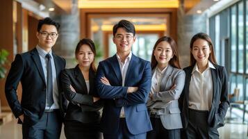 ai generado retrato de un grupo de asiático negocio persona en pie juntos en un oficina Entrada foto