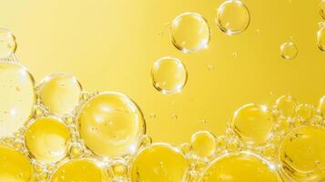 AI generated Golden yellow bubble oil or serum isolated on yellow background photo