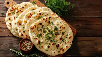 AI generated Indian naan bread on wooden desk photo