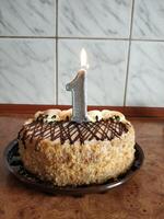 Cake with a number one candle photo