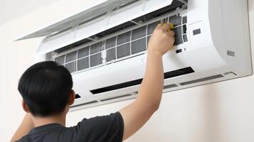 AI generated boy repairing air conditioner in the house. concept of maintenance and repair photo