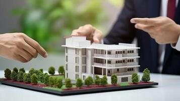 AI generated Real estate agent presenting house model to customer. Real estate business concept. photo