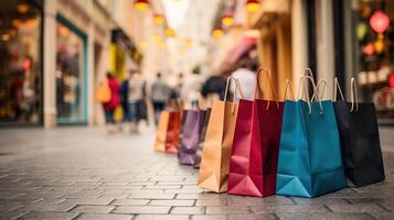 Colorful paper shopping bags in a shopping street in Paris, France photo