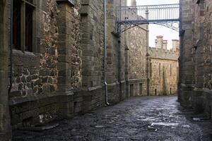 passage between the walls of old palace that looks like a medieval street photo