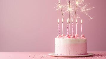 AI generated Pink birthday cake with many pink birthday candles and sparklers against a pink background with copy space photo