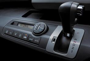 Automatic gear shift and air conditioning panel in a modern car. After some edits. photo