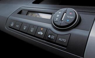 Air conditioner in a modern car, closeup of the buttons. After some edits. photo