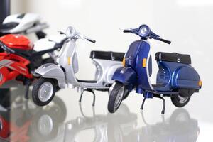 Selective focus. Model of motorbikes placed on glass shelf. After some edits. photo