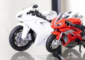 Selective focus. Model of motorbikes placed on glass shelf. After some edits. photo
