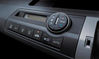 Air conditioner in a modern car, closeup of the buttons. After some edits. photo