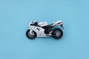 Sporty motorbike isolated on blue background. After some edits. photo