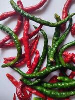 Natural spicy red and green chilies. Organic fresh chili peppers isolated on white. photo