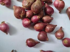 Red whole onion isolated on white background photo