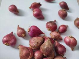 Red whole onion isolated on white background photo