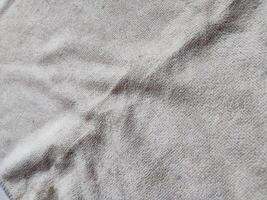 texture, pattern, background of dirty white towel exposed to sunlight photo