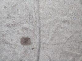 texture, pattern, background of dirty white towel exposed to sunlight photo