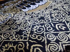 Muslim prayer rug islamic textile.Arabian ornament with decorative elements Praying arabian mats. photo