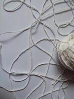 Realistic white merino wool fabric isolated on white photo