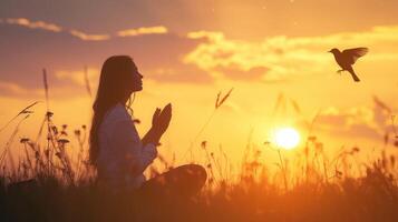 ai generado mujer Orando y gratis pájaro disfrutando naturaleza en puesta de sol fondo, esperanza concepto foto