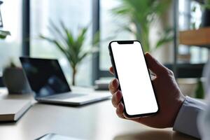 AI generated A man's hand holding a smartphone in modern office with white blank screen, First person view photo