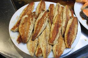 fried fish on the counter. fresh and delicious salmon photo