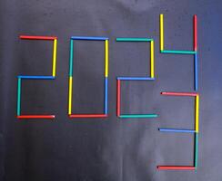 Happy New Year 2024 Idea. Transition from 2023 to new year 2024 concept with text on wooden blocks. Creative Concept. photo
