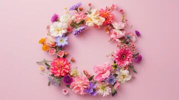 AI generated Spring wreath made of colorful flowers on pink background, place for text, holiday concept. Flat lay photo