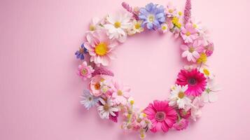 AI generated Spring wreath made of colorful flowers on pink background, place for text, holiday concept. Flat lay photo