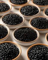 ai generado caviar en pequeño bochas, muchos bochas de caviar en el mesa, bueno composición en el mesa, el parte superior mesa es ligero cemento foto