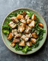 AI generated Salt-baked celeriac roast salad with creamy miso mustard dressing on light green plate, the table for placing plates is top cements table photo