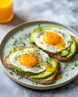 AI generated Seasoning avocado toast on plate light green spots, sprinkled with black pepper, beside the plate there is orange juice photo