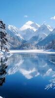 ai generado escénico invierno vista sereno lago enmarcado por nieve tapado montañas vertical móvil fondo de pantalla foto