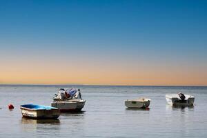 Fishing boats on the sea and the incredible sky photo