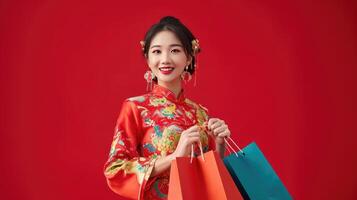 AI generated Happy Asian shopaholic woman wearing traditional cheongsam qipao dress holding shopping bag isolated on red background. Happy Chinese new year photo
