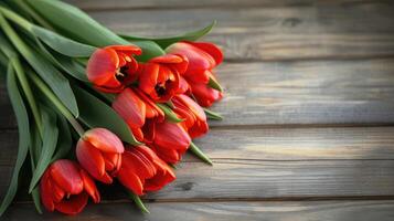 ai generado ramo de flores de rojo tulipanes en un de madera antecedentes. primavera flores de la madre día antecedentes. foto