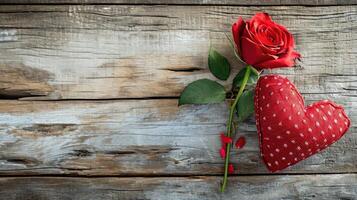 AI generated Happy valentine's day card with red rose and fabric heart shape on vintage wood background photo