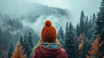 AI generated Autumn . Woman puts on knitted hat during hike in mountains forest in cold foggy weather photo