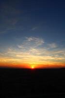 Cumulus clouds and different color tones in the sky at sunset. Amazing and incredible sunset. photo