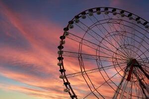 Ferris wheel in a playground in Batumi Square. Amazing and fanfastic sky. photo