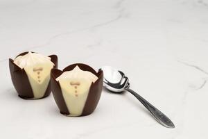 Dark Chocolate Tuxedo Cups Filled with Mousse photo
